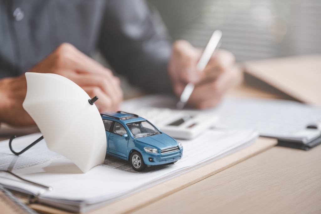 car-insurance-concept-with-toy-car-and-umbrella-2026-01-08-08-12-23-utc (1)